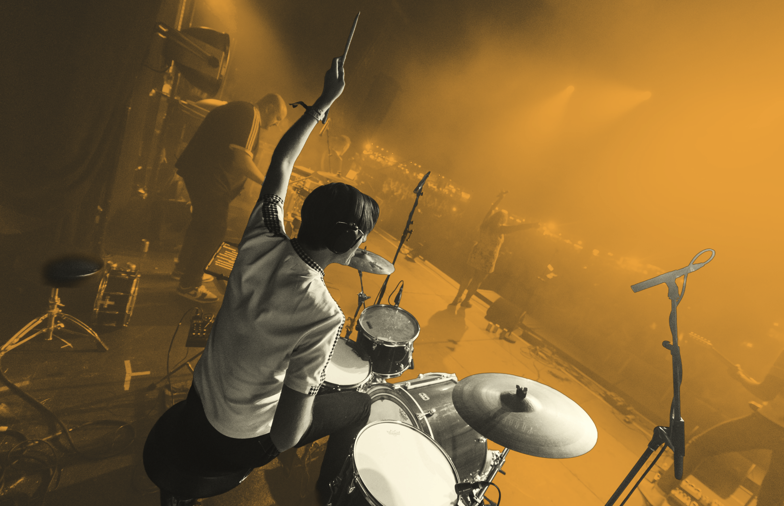Drummer performing live on stage